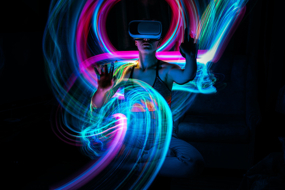Metaverse Digital Avatar, Metaverse Presence, Digital Technology, Cyber World, Virtual Reality, Futuristic Lifestyle. Woman in VR Glasses Playing AR Augmented Reality NFT Game with Neon Blur Lines